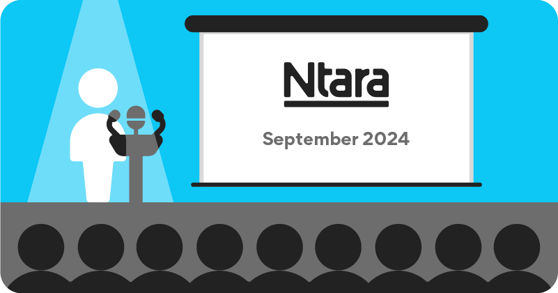 Illustration of a person on stage presenting to several people in an audience. The person icon on stage is white, standing in front of a gray podium. The person icons in the audience are black on a gray background. On the white screen is the word Ntara, bolded and underlined. Under that it says September 2024 in gray.